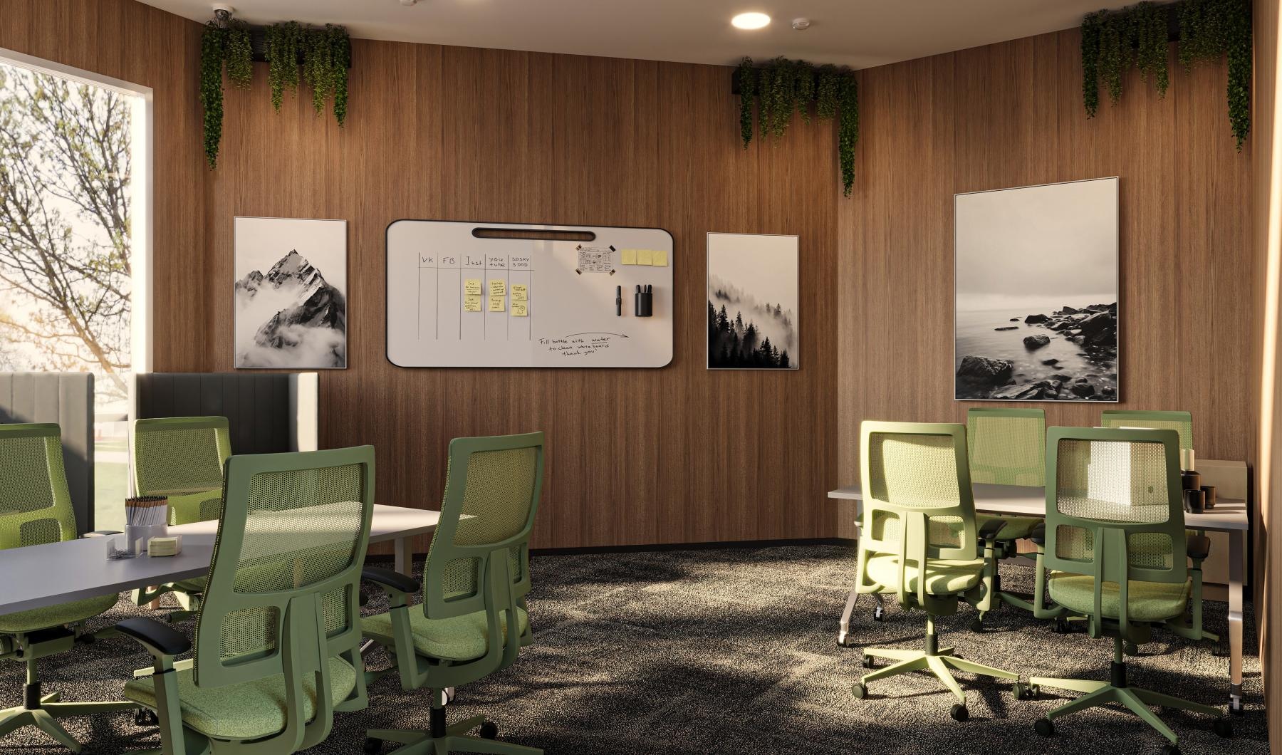 a room with green chairs and a white board with pictures on it
