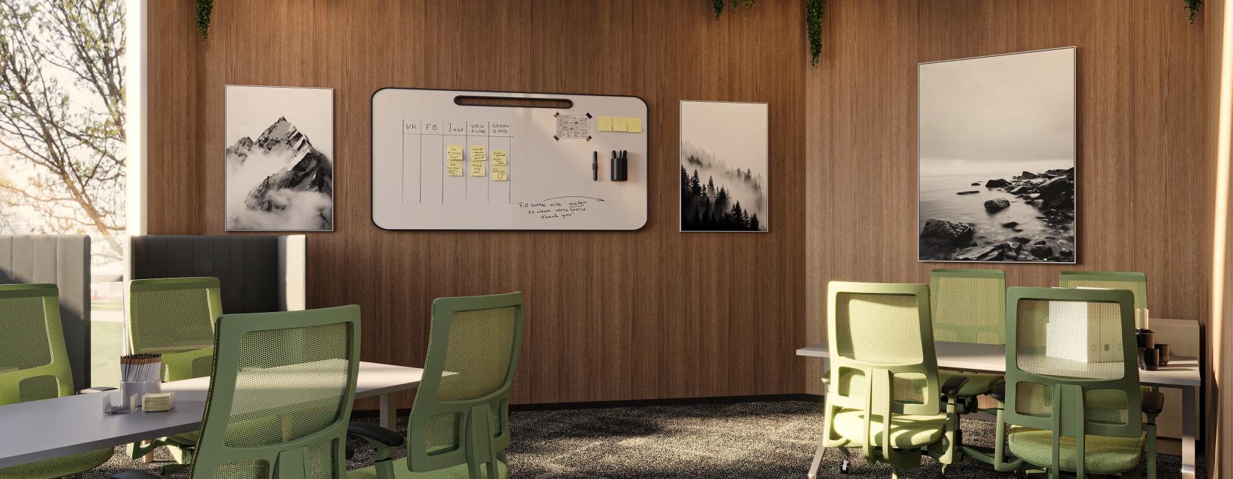 a room with green chairs and a white board with pictures on it